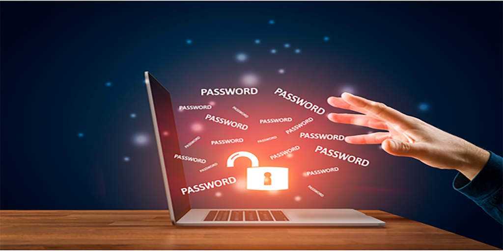 Cybersecurity Persona Quiz 3 Conceptual cybersecurity image showing an open laptop on a wooden desk with a glowing red padlock icon on the screen surrounded by the repeated word “PASSWORD,” while a hand reaches toward the screen, suggesting password theft or hacking risk.